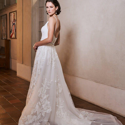 Model wearing Samara wedding dress with floral skirt from the Royal collection