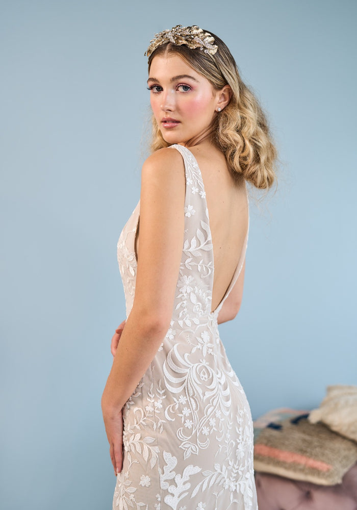 Model wearing fit-n-flare Star wedding dress with bohemian inspired lace from the Mademoiselle collection