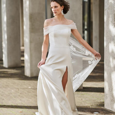 Model wearing Sabrina with tulle off-shoulder sleeves from the Royal collection