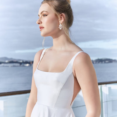 Side view of the bodice of Trinity gown. Uniquely shaped bust darts and illusion mesh paneling at the sides create sleek lines on this square neck gown.