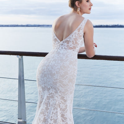 Back view of Tanya gown with deep V back. Fitted across the hips and flaring to the hem. 