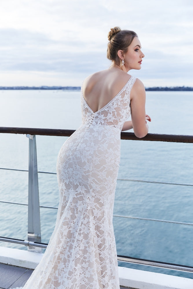 Back view of Tanya gown with deep V back. Fitted across the hips and flaring to the hem. 